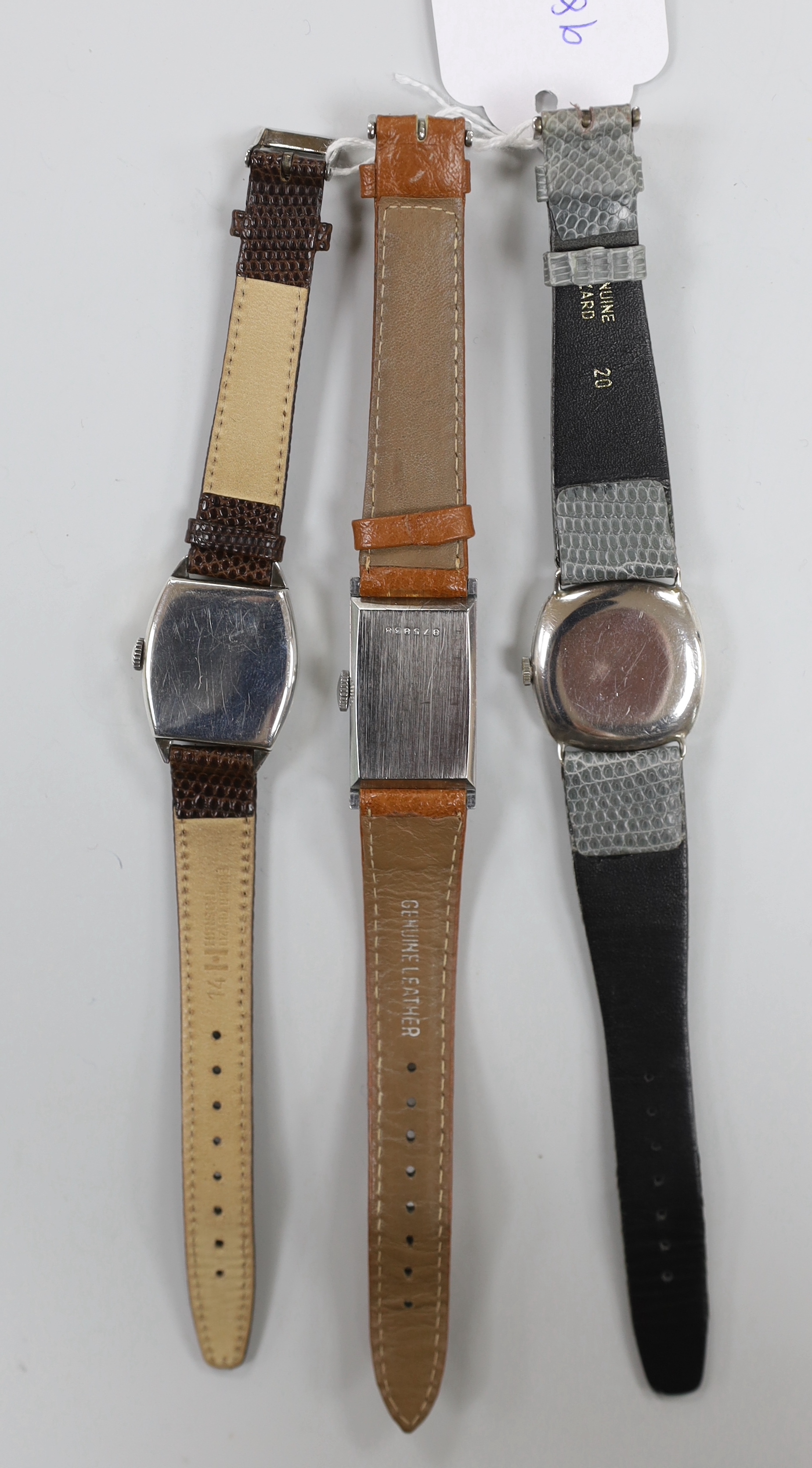 A gentleman's 1930's? silver manual wind wrist watch, with sunburst Arabic dial and subsidiary seconds, one other similar silver manual wind tonneau cased wrist watch and a stainless steel LIP manual wind wrist watch.